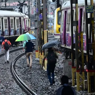 Mumbai Local Trains Delayed by Rain and Snags