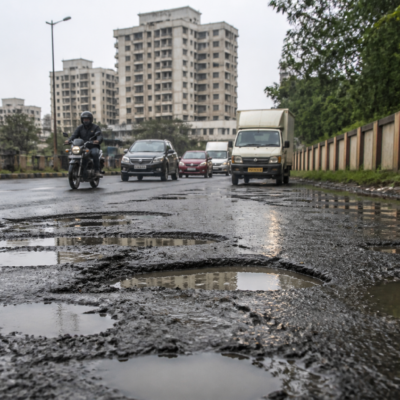 Pothole-filled road in Vasai-Virar awaiting repairs before the Dahi Handi festival