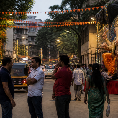 Ganeshotsav decorations and a public street in Pune amid debate over festival noise and civic inconvenience