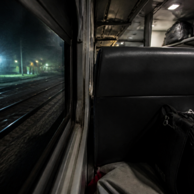 Passengers inside an Indian express train during a night journey, illustrating train theft and railway passenger safety concerns
