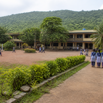 Government ashram school building in Thane division linked to teacher recruitment and document verification for 424 candidates