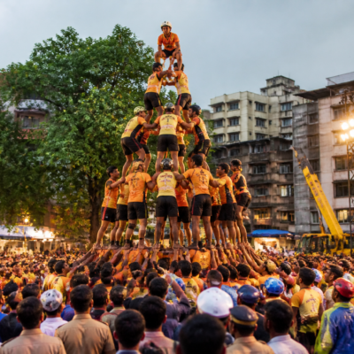 Govinda teams forming a human pyramid during a Dahi Handi celebration at Tembhi Naka in Thane