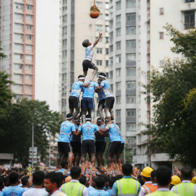 Govinda teams forming a human pyramid during a Dahi Handi celebration in Thane, illustrating the safety risks associated with Dahi Handi accidents