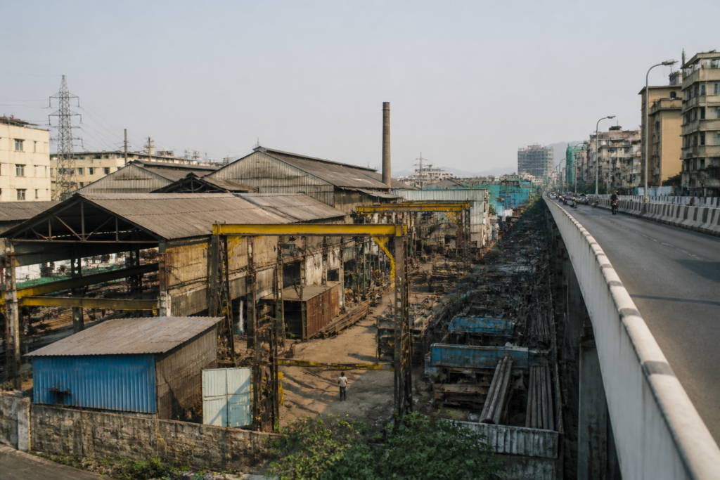 Industrial units in a Mira-Bhayandar industrial estate beside an urban road