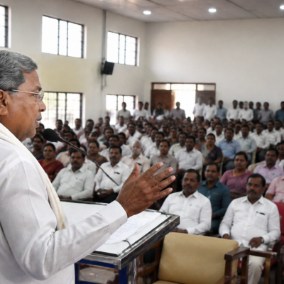 Karnataka Deputy Chief Minister G. Parameshwara speaking at a public programme in Tumakuru about the Old Pension Scheme