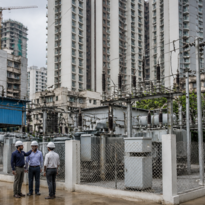 Electricity infrastructure serving a dense Mumbai residential redevelopment area, illustrating BEST’s drive to add new electricity customers