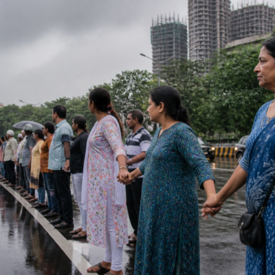 Residents form a human chain on Pokhran Road in Thane to protest the proposed internal circular metro project and tree removal.
