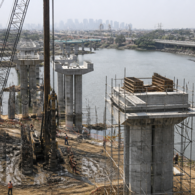 Construction activity on the Gaimukh-Payegaon Bridge project across the Thane creek in Maharashtra