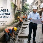 Civil works crew improving drainage and passageway near residential buildings in Mulund West, Mumbai