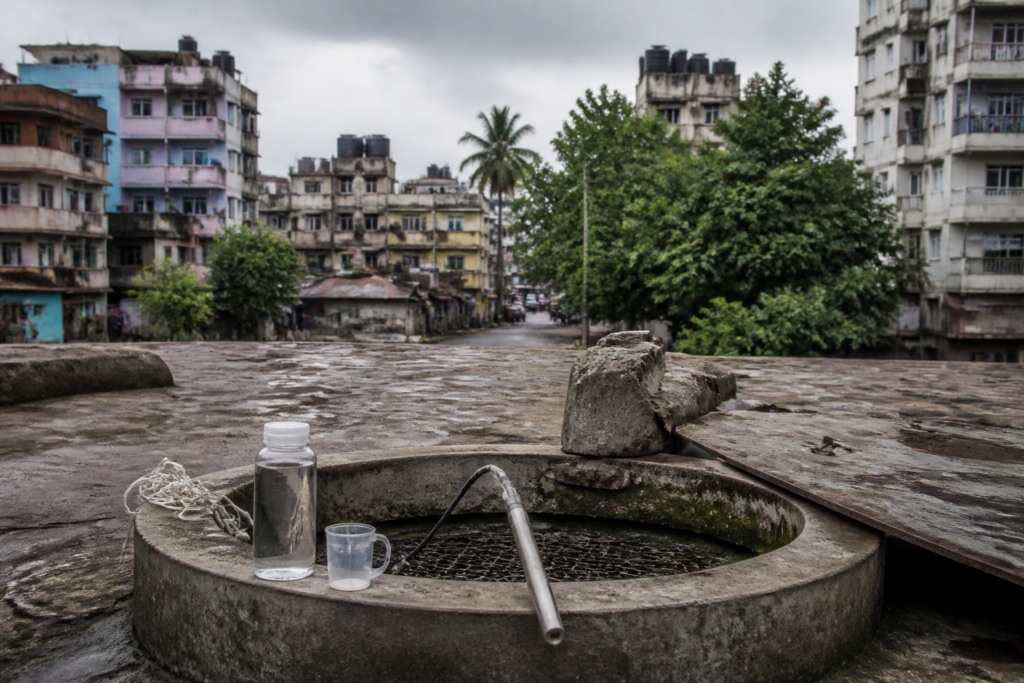 Mumbai groundwater risk near a coastal neighbourhood with wells and dense urban buildings