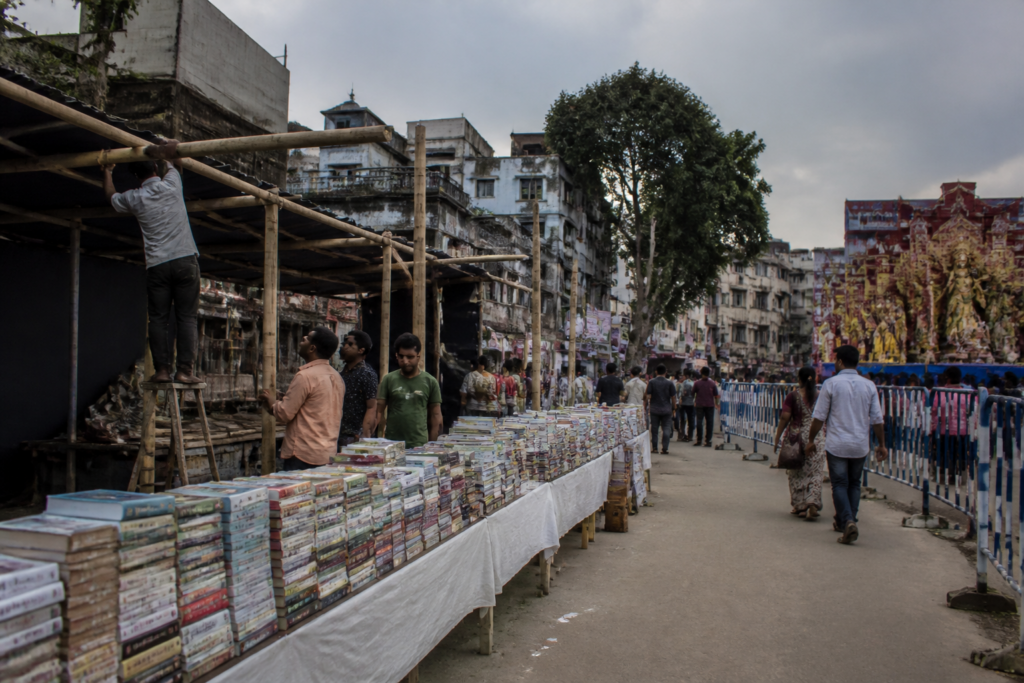 Temporary Durga Puja bookstalls in Kolkata amid a permissions dispute