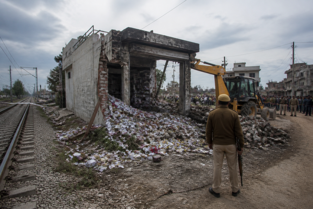 Mansa bulldozer action outside a demolished medical store in Punjab