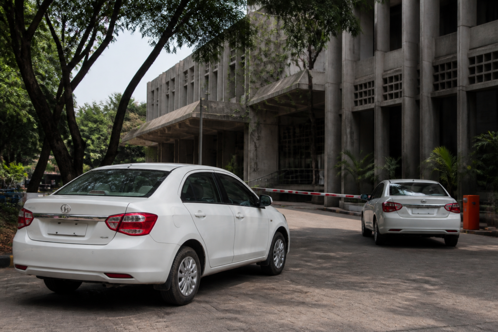 Gujarat University official car outside an administrative building in Ahmedabad