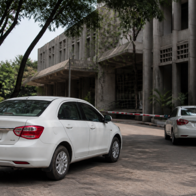 Gujarat University official car outside an administrative building in Ahmedabad