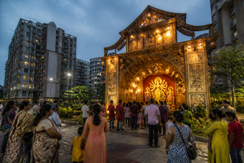 Kolkata housing societies Durga Puja pandal displaying a community-focused cultural theme