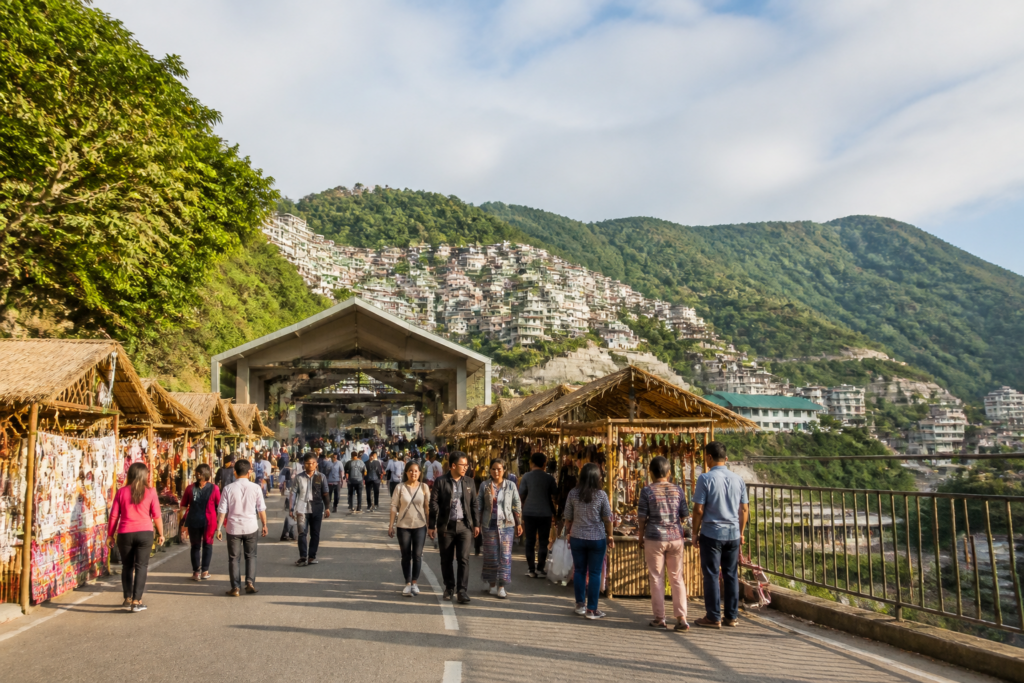 Mizoram tourism festival and Aizawl’s hill-city landscape with visitors and urban infrastructure