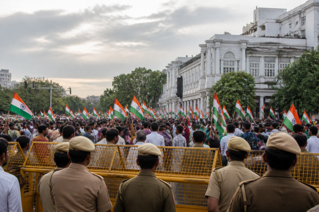 Tiranga March Delhi supporters carrying Indian flags near Connaught Place