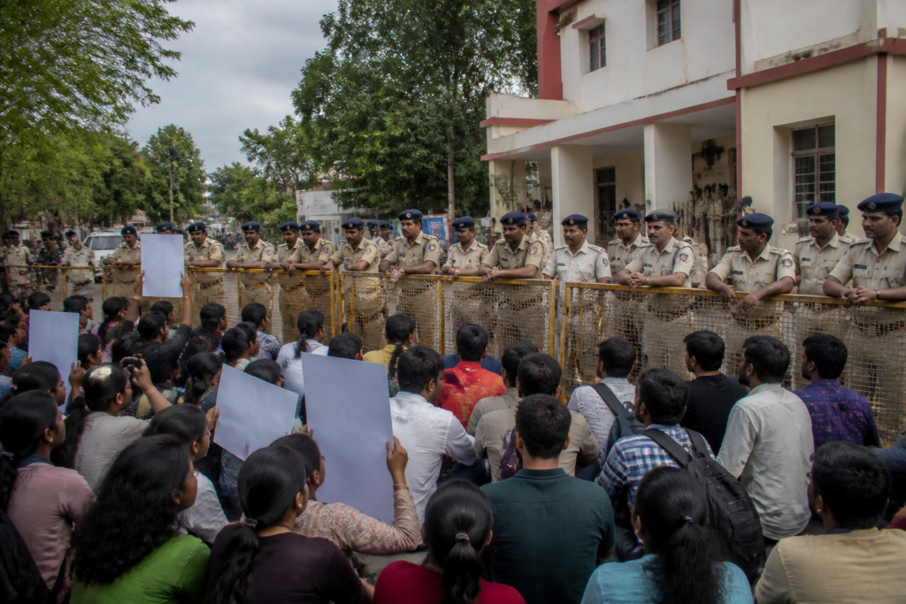Bhopal police suspension after an alleged incident involving tribal students during a protest