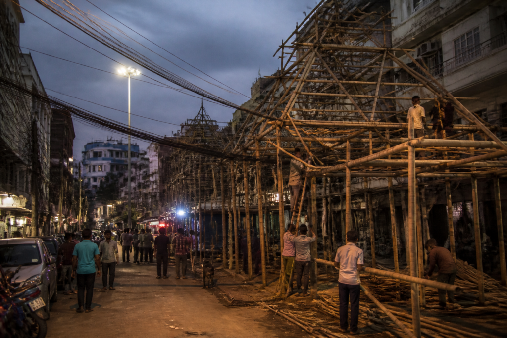 Patna Durga Puja pandal area facing overhead cables and congested streets