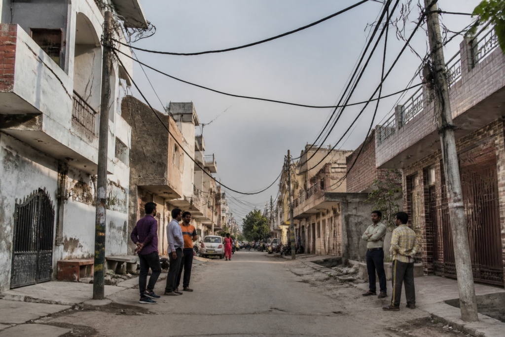 Faridabad power problems with overhead electricity lines near homes in a residential colony