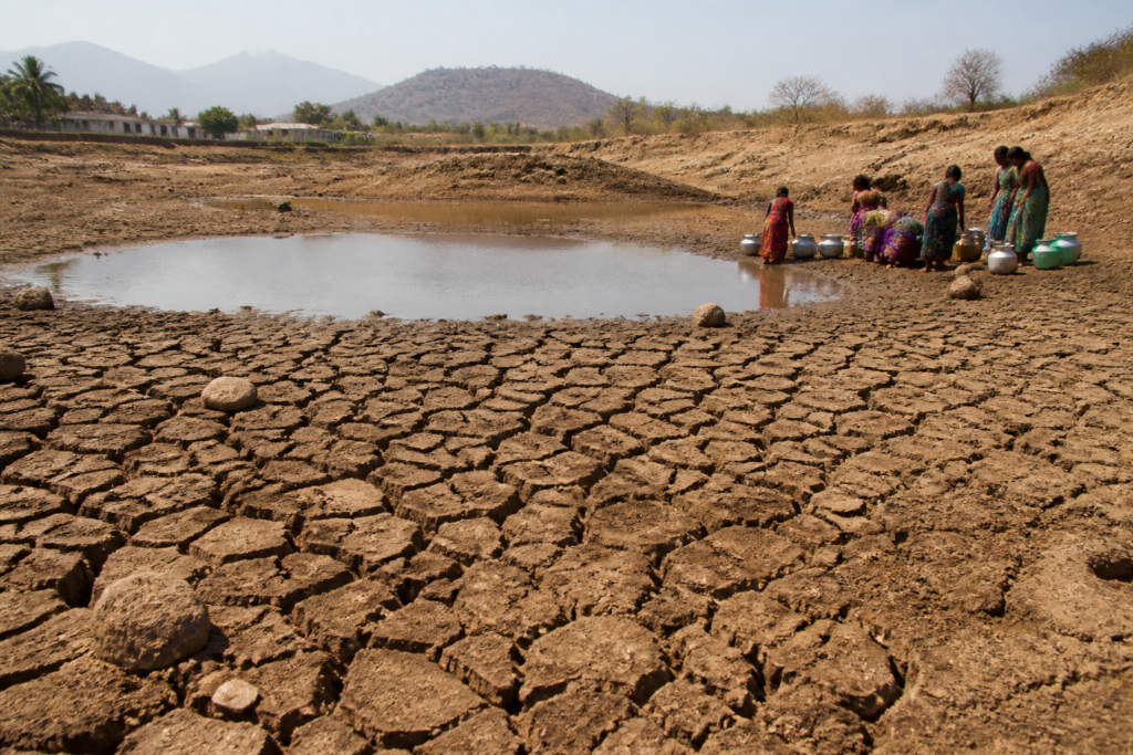 Karnataka drought conditions affecting a rural settlement and dry agricultural land