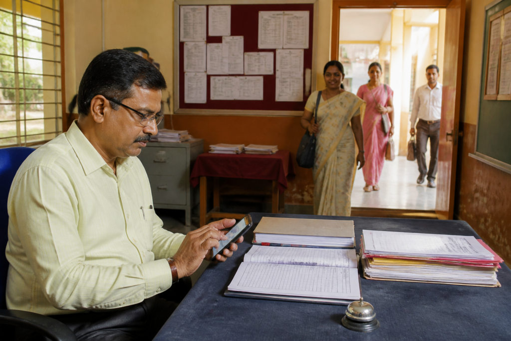 Maharashtra smart attendance system being used to record teacher attendance at a school