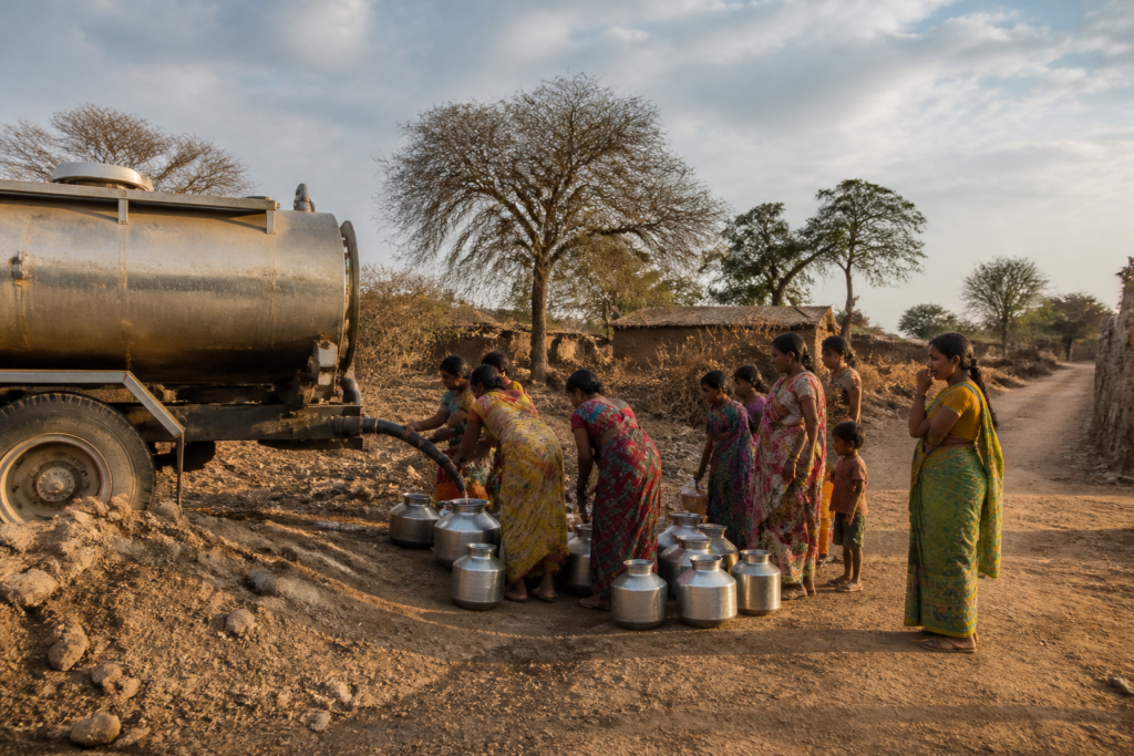 Pune water crisis response with a tanker supplying a rural settlement in Pune district