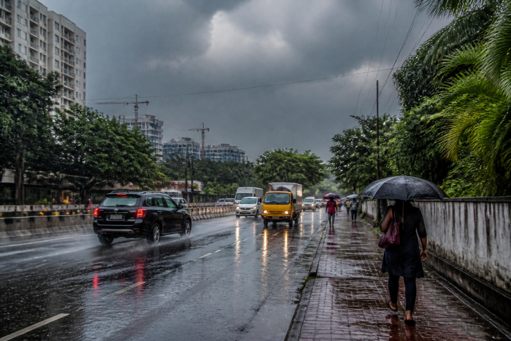 Kerala orange alert as rain clouds gather over a waterlogged urban road in Kochi