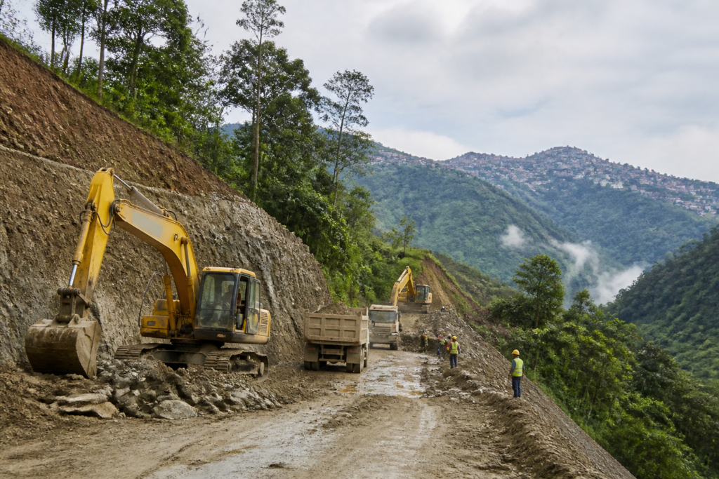 Aizawl western bypass construction site with earthwork and heavy machinery in Mizoram