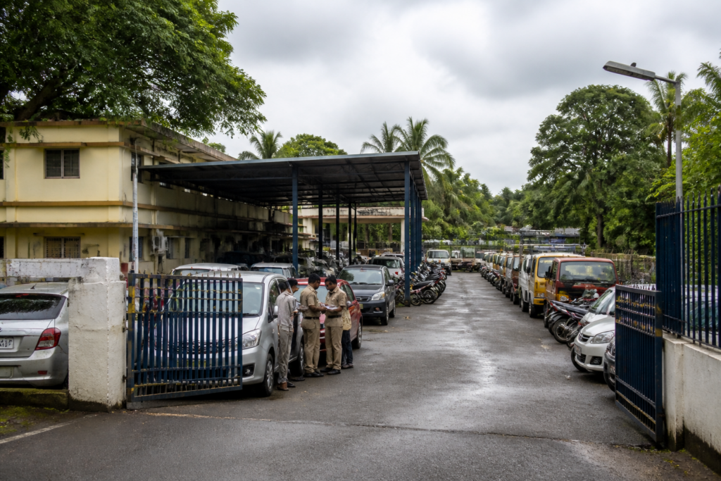 Kerala vehicle tax enforcement yard with seized cars awaiting release