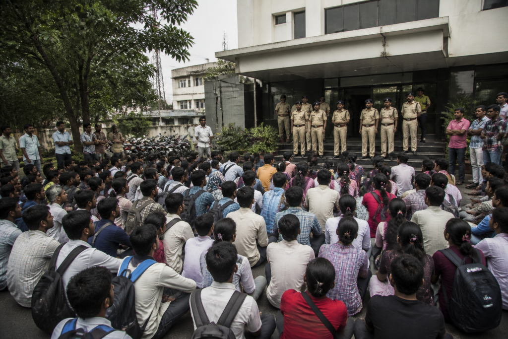 Bhopal police suspension after an alleged confrontation with tribal students during a city protest