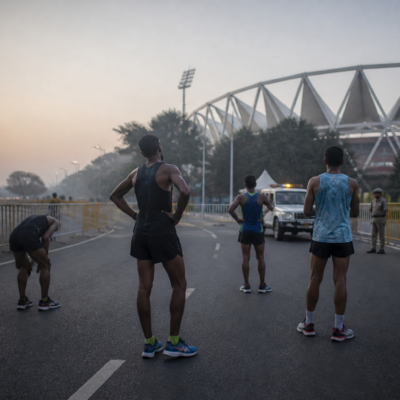 Delhi Half Marathon route near Jawaharlal Nehru Stadium with runners and managed city roads