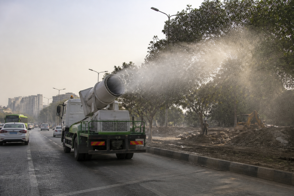 Delhi anti-smog guns being used for dust control on a busy South Delhi road