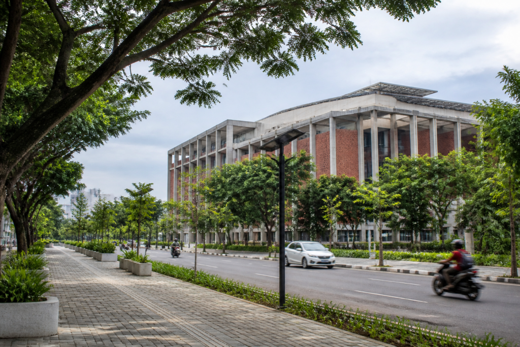 Kochi climate action represented at a city council building amid green urban surroundings