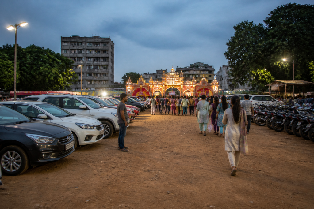 Jamshedpur Durga Puja parking zone near a crowded pandal area