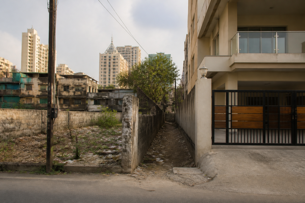 Maharashtra government land plots beside an urban property in Mumbai