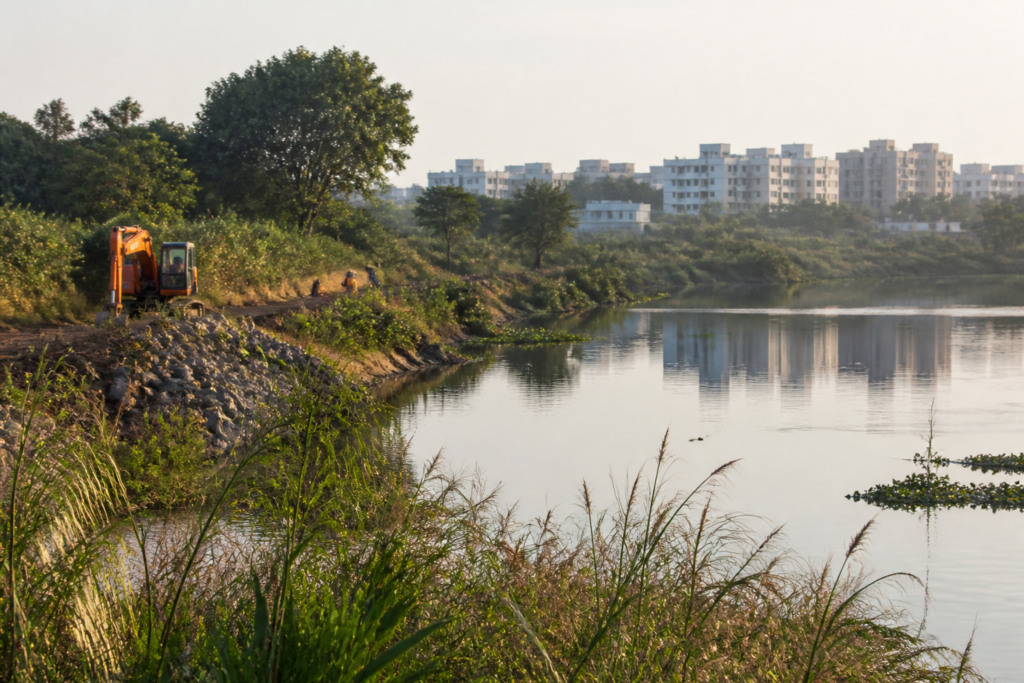 Kapra Lake revival work in Hyderabad, showing the urban wetland and surrounding landscape.