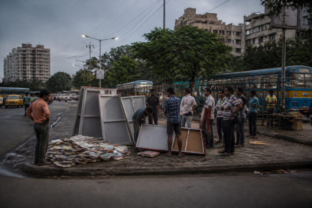 Dhakuria bookstall attack site near a Kolkata bus stand with a damaged temporary stall