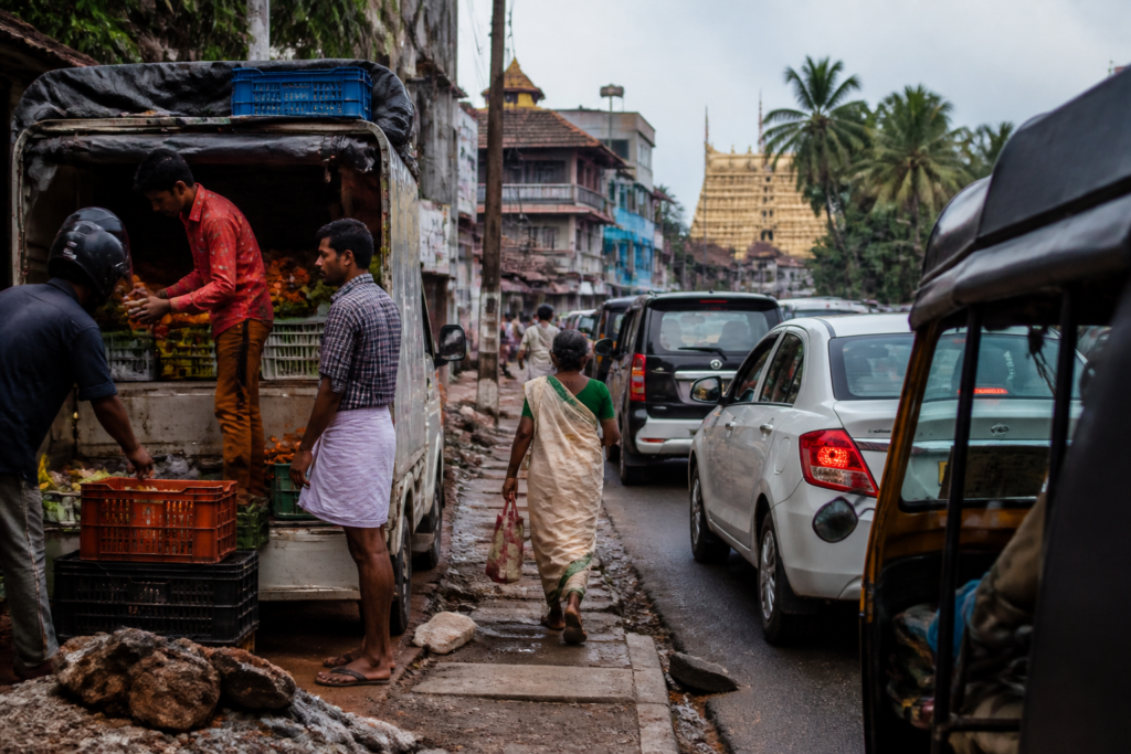 Thrippunithura road encroachment blocking a busy street beside a damaged footpath