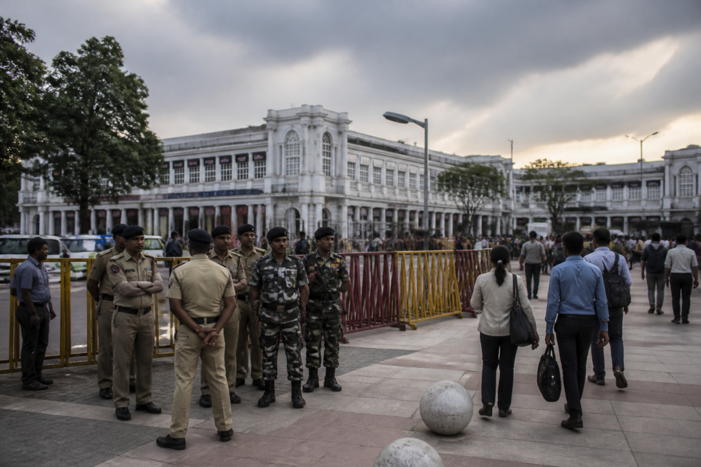 Delhi protest security personnel and barricades near Connaught Place
