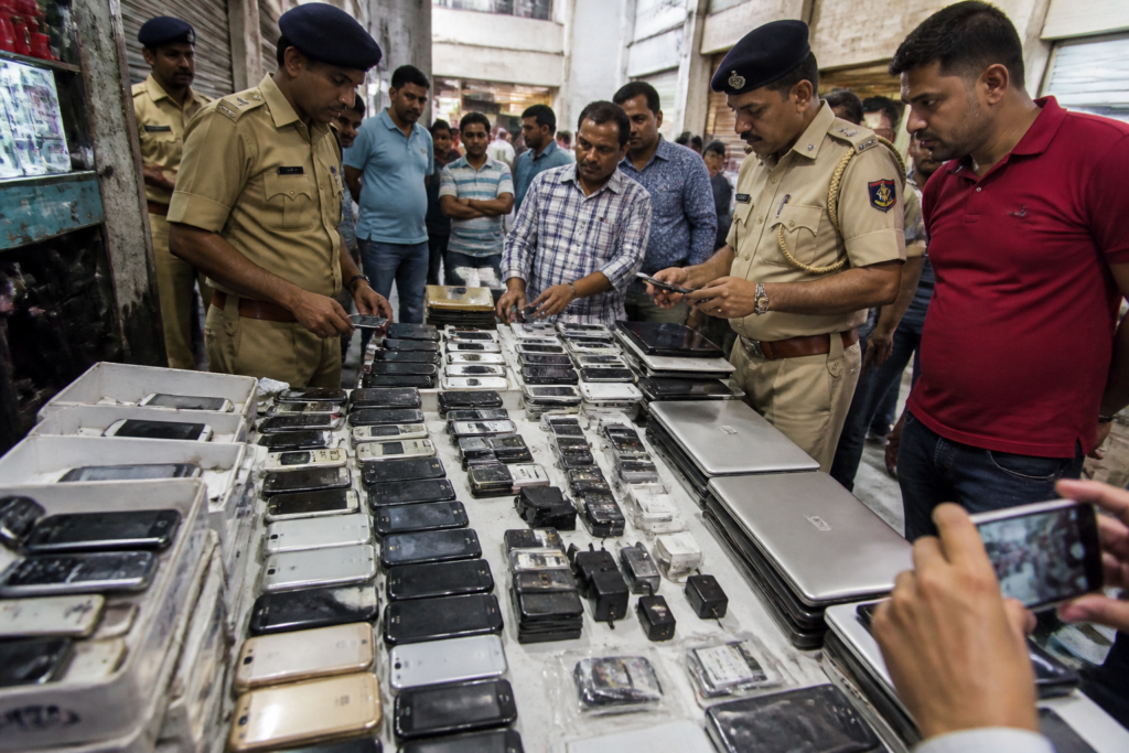 Counterfeit Samsung phones seized during a police raid in Ahmedabad's Geetamandir mobile market