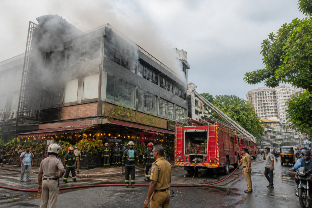 Firefighters respond to a Kochi building fire near Kacheripady Junction.
