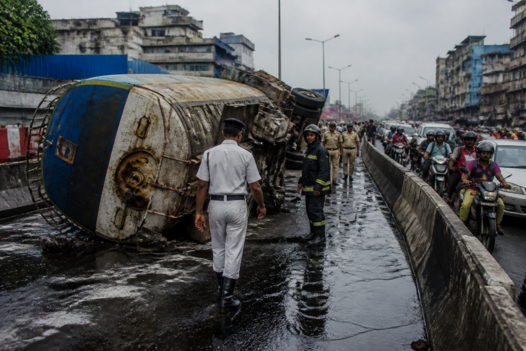 Oil tanker overturned after a Jessore Road diesel spill near Birati, with traffic diverted around the crash.