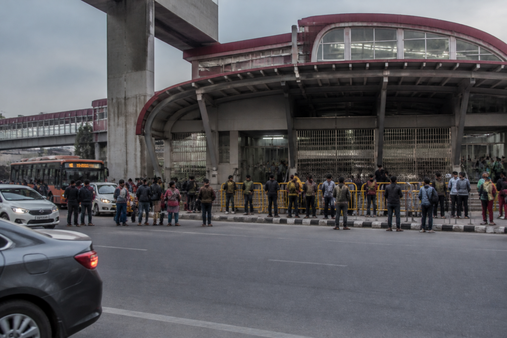 Delhi Metro restrictions with commuters outside a station during heightened security measures