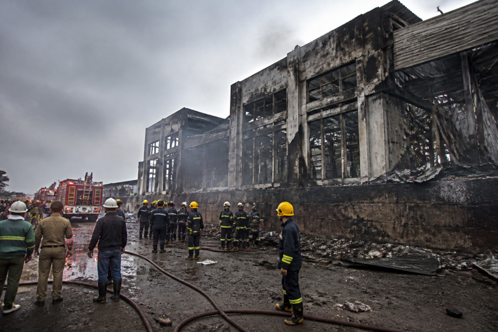 Firefighters respond to the Sonipat factory fire at a damaged mattress manufacturing unit.