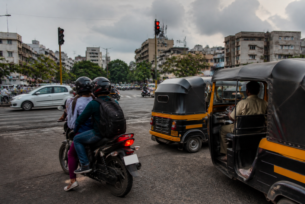 Pune bike taxis and auto-rickshaws on a city road