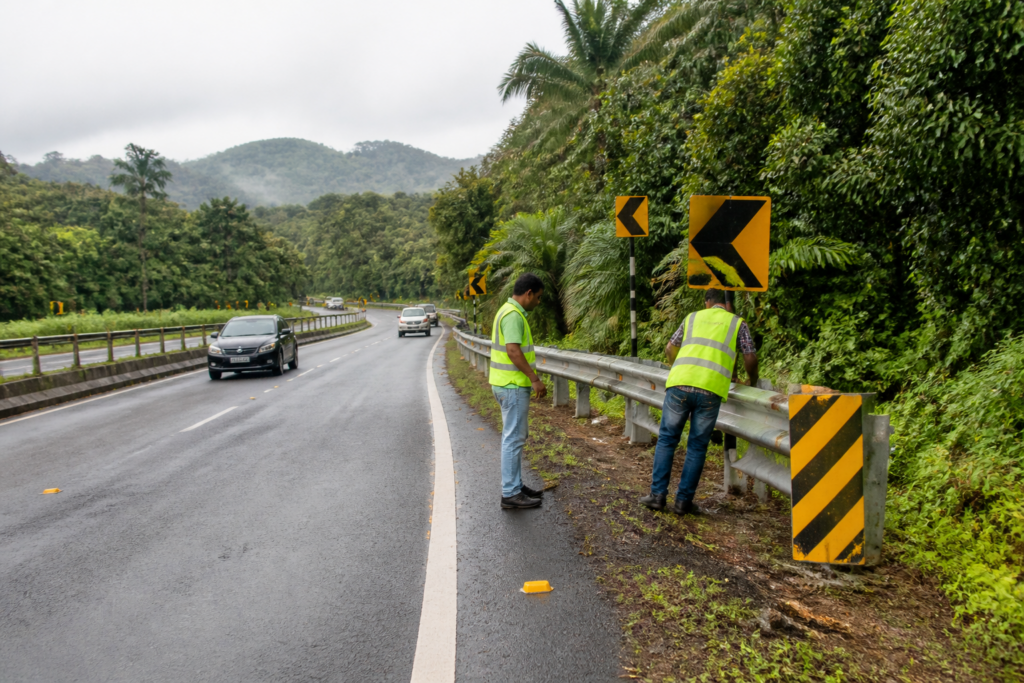 Kerala road safety measures on a national highway with barriers, signs and reflective markings