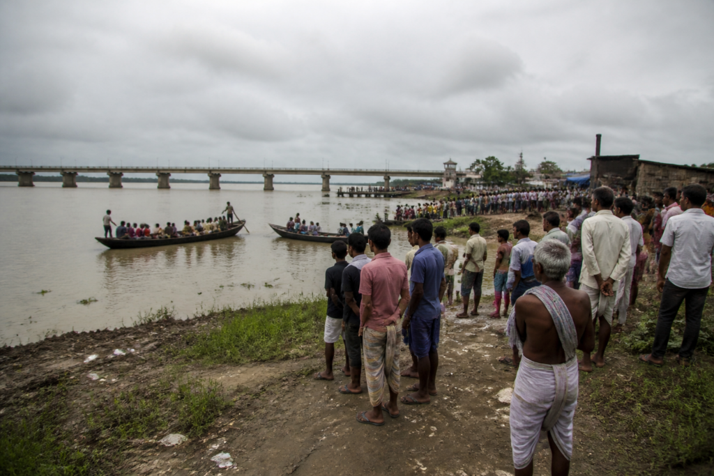 Raghopur boat tragedy site with a river crossing and local boats in Vaishali, Bihar