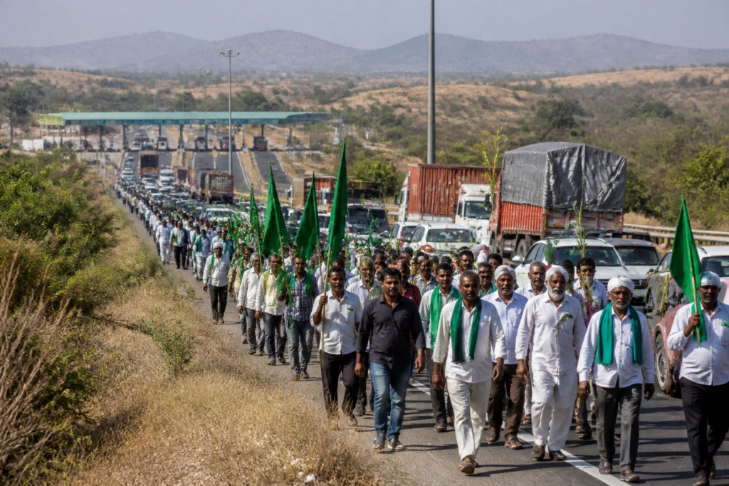 Sugarcane farmers’ protest march along a highway near Belagavi in Karnataka