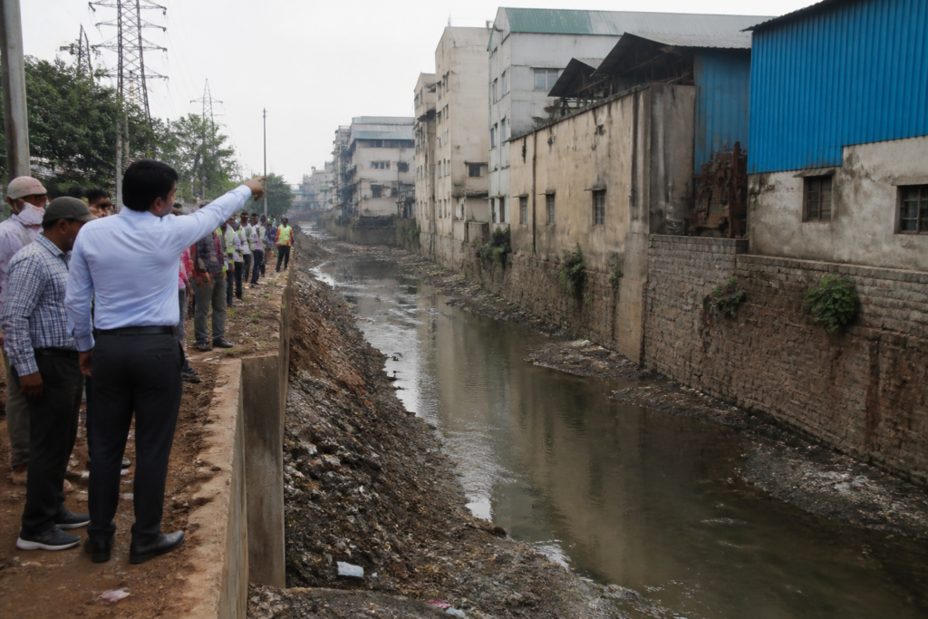 Kukatpally Nala encroachments along a narrowed stormwater drain in Hyderabad